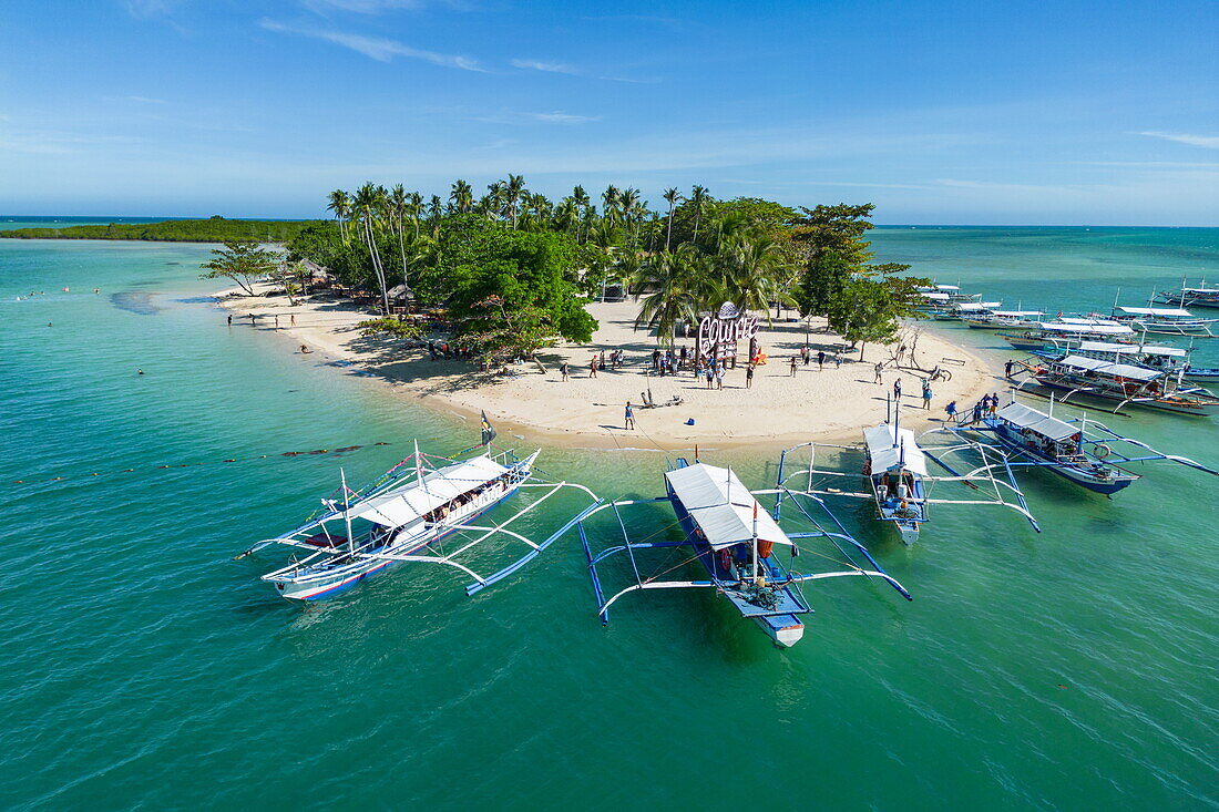  Aerial photographs of Bangka outrigger canoe tour boats on Cowrie Island, Honda Bay, near Puerto Princesa, Palawan, Philippines 