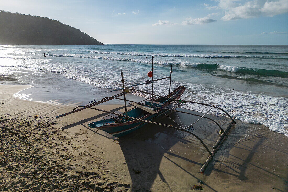  Aerial view of a Bangka outrigger canoe at Nagtabon Beach, Bacungan, near Puerto Princesa, Palawan, Philippines 