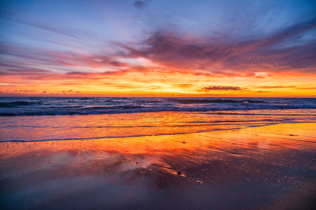  Sunset at sea with cloudy sky 