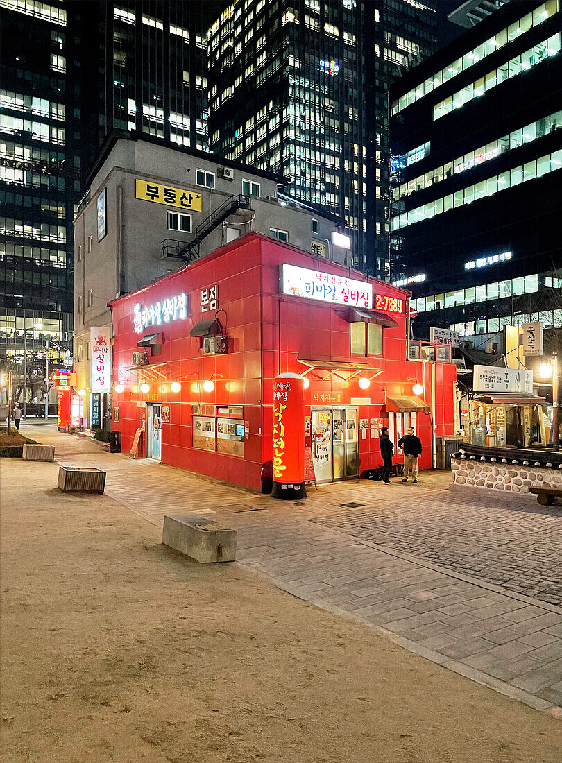  small red restaurant between skyscrapers at night, neon lighting, Insadong, Seoul, South Korea, Asia 