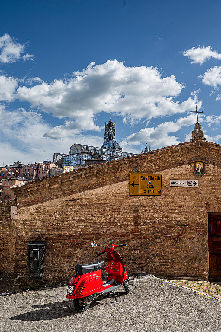  Red Vespa in the foreground, view of old town cathedral with tower, Siena, Tuscany region, Italy, Europe 