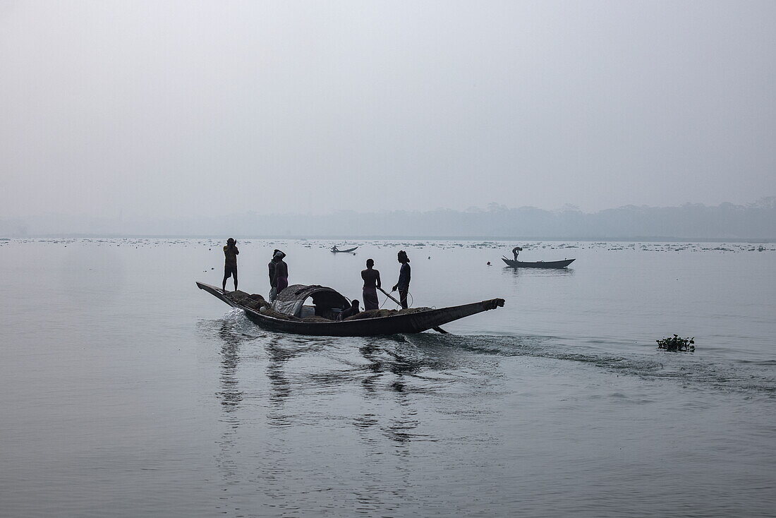  Silhouette of fishing canoes on river, near Barisal (Barishal), Barisal District, Bangladesh, Asia 