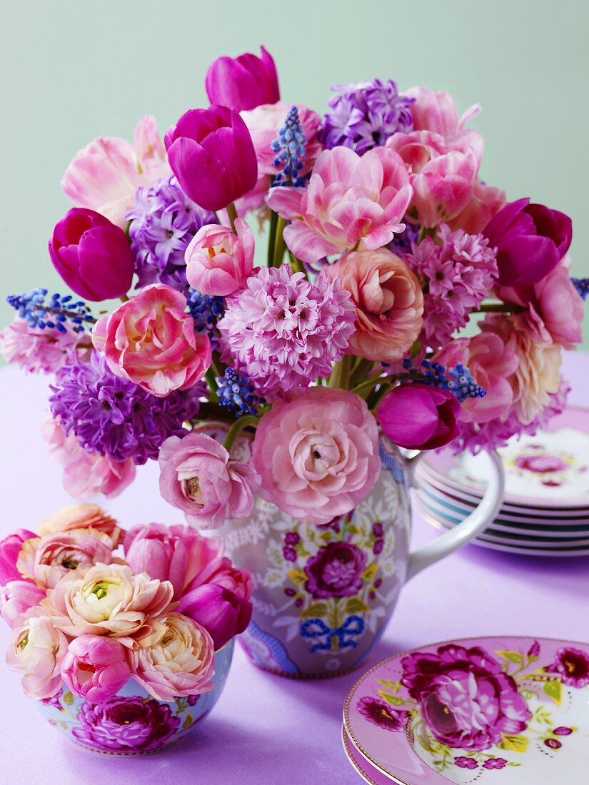 A bunch of flowers in various shades of pink