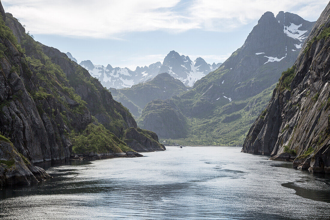 Steep sided glacial trough fiord jagged mountain peaks, Trollfjorden, Lofoten Islands, Nordland, northern, Norway