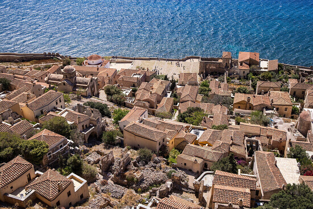  View over tiled roofs and the sea seen from the upper town, Monemvasia, Peloponnese, Greece, Europe 