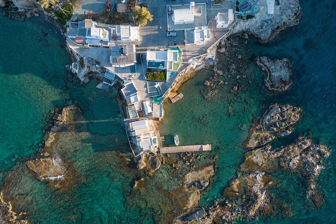  Aerial view of Mandrakia fishing village with bay and coast, Triovasalos, Milos, South Aegean, Greece, Europe 