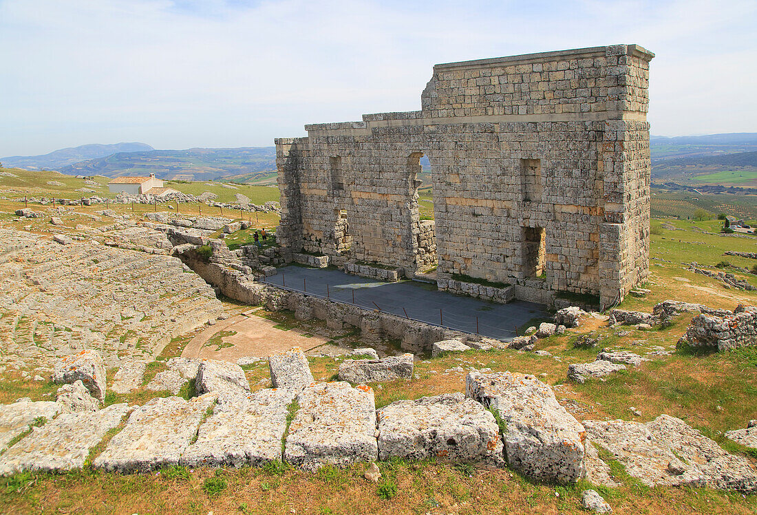 Remains of  Roman theatre stage background wall and seating area, Acinipo Roman town site Ronda la Vieja, Cadiz province, Spain