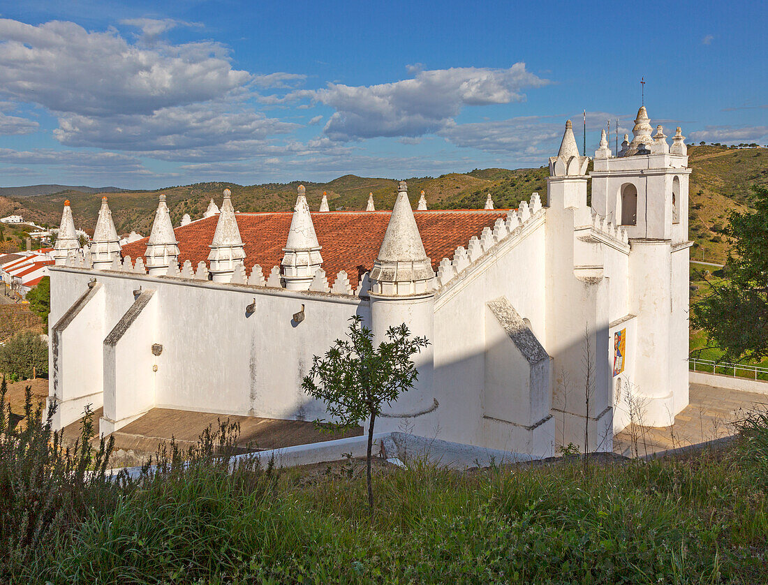 Architectural details of conical roof decorations historic whitewashed church Igreja Matrix in medieval village of Mértola, Baixo Alentejo, Portugal, Southern Europe