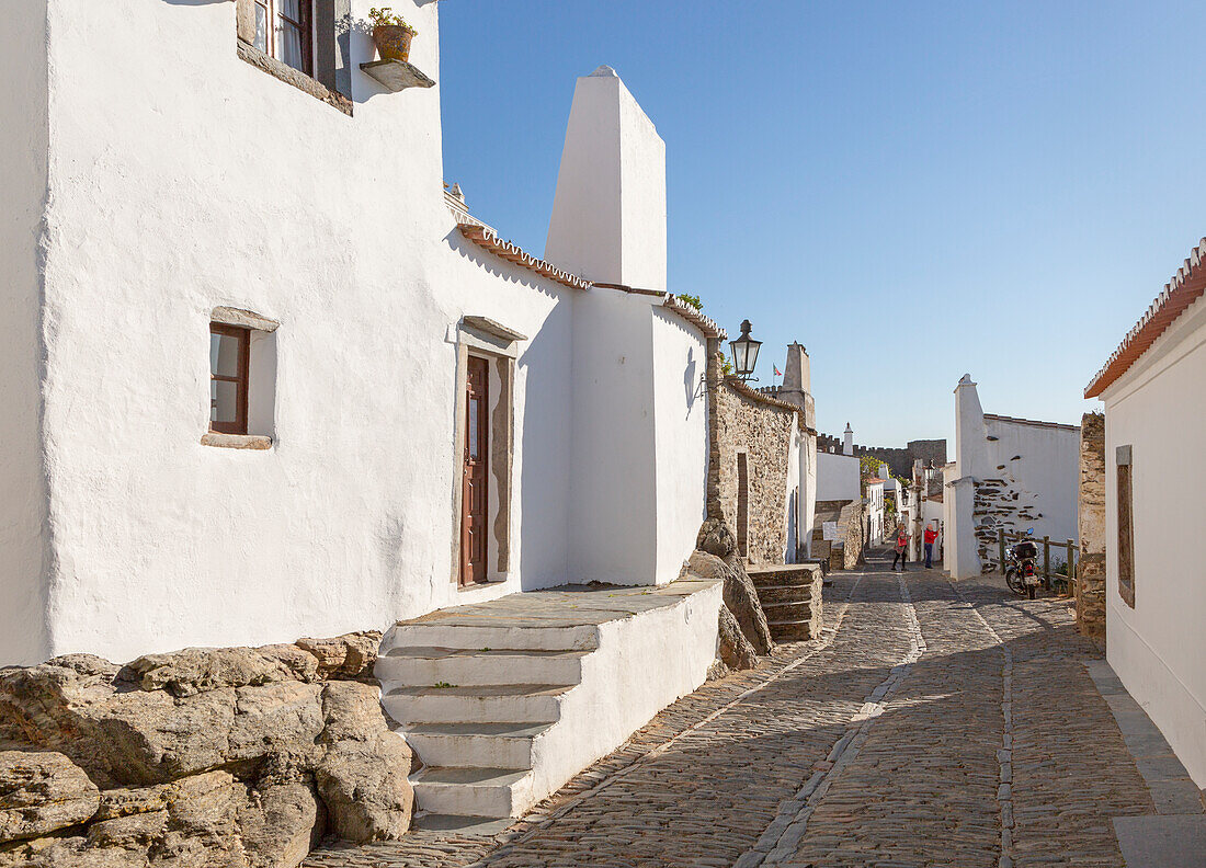 Historic cobbled street whitewashed buildings  walled hilltop village Monsaraz, Alto Alentejo, Portugal, southern Europe