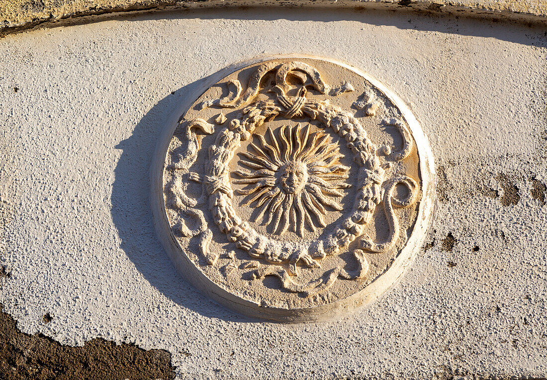 Stone or plasterwork image of the sub set in a wall, Mijas pueblo, Malaga province, Andalusia, Spain