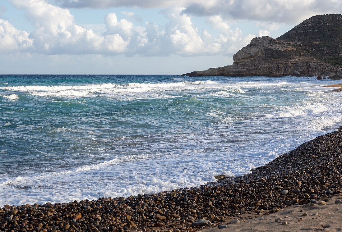 Waves breaking on beach at Las Negras, Cabo de Gata Natural Park, Nijar, Almeria, Spain