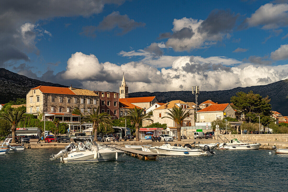  City view with harbor and church Crkva Marija Pomoćnica in Orebic, Peljesac peninsula, Croatia, Europe  