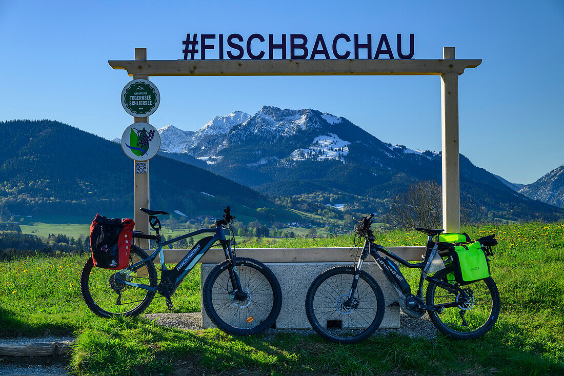  Two bicycles standing in front of a picture frame with the Mangfall Mountains in the background, Lake Constance-Königssee cycle path, Fischbachau, Leitzachtal, Upper Bavaria, Bavaria, Germany 