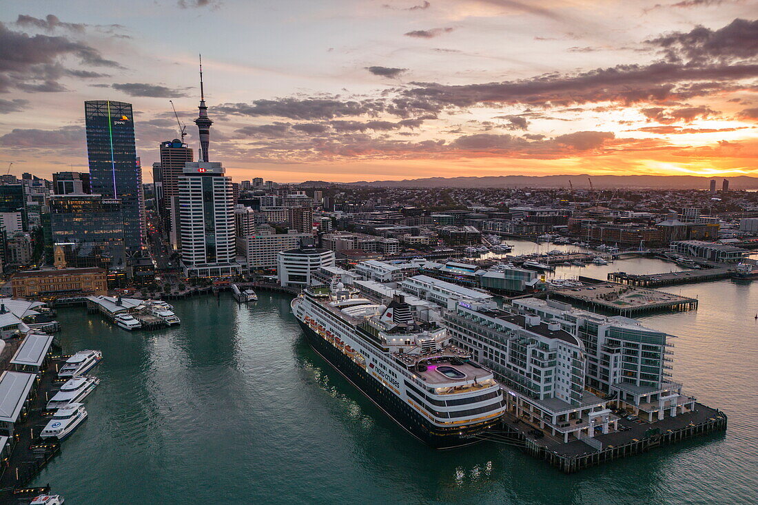  Aerial view of cruise ship Vasco da Gama (nicko cruises) at Princes Wharf and skyline at sunset, Auckland, North Island, New Zealand 