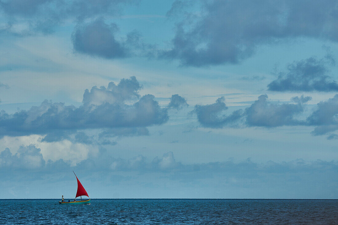  Africa, Mauritius Island, Indian Ocean, sailing boat with red sail in the lagoon 