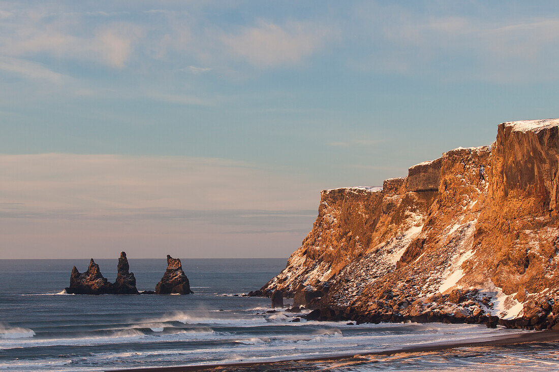  Basalt rock needles Reynisdrangar, Reynisfjara, winter, Iceland 