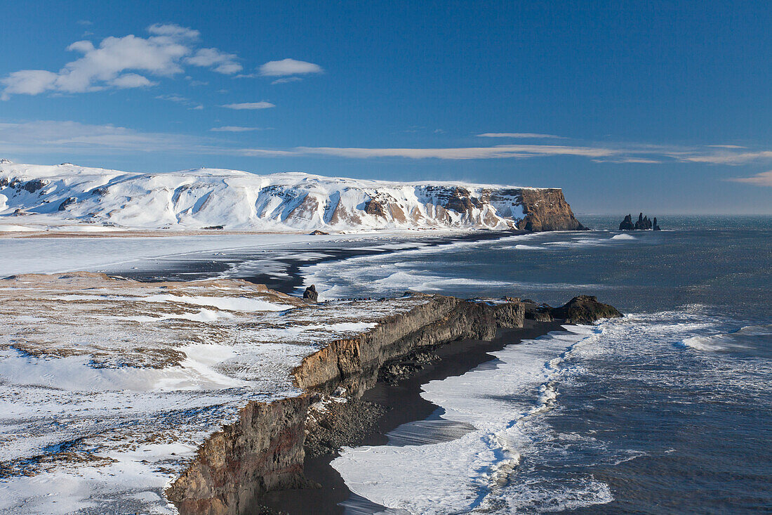  Basalt rock needles Reynisdrangar, Reynisfjara, winter, Iceland 