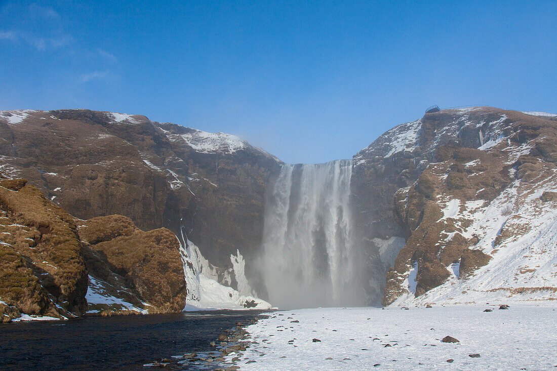  Skogafoss, 63m high waterfall, winter, Iceland 