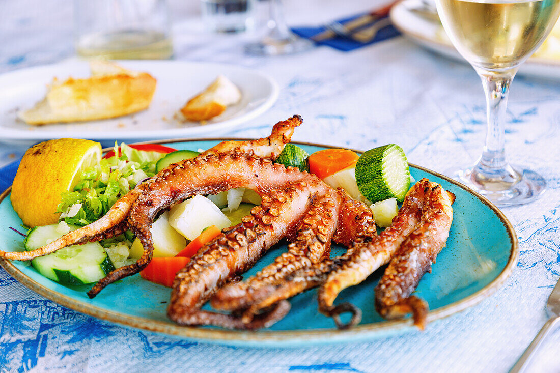  grilled octopus with vegetables on the island of Kos in Greece 