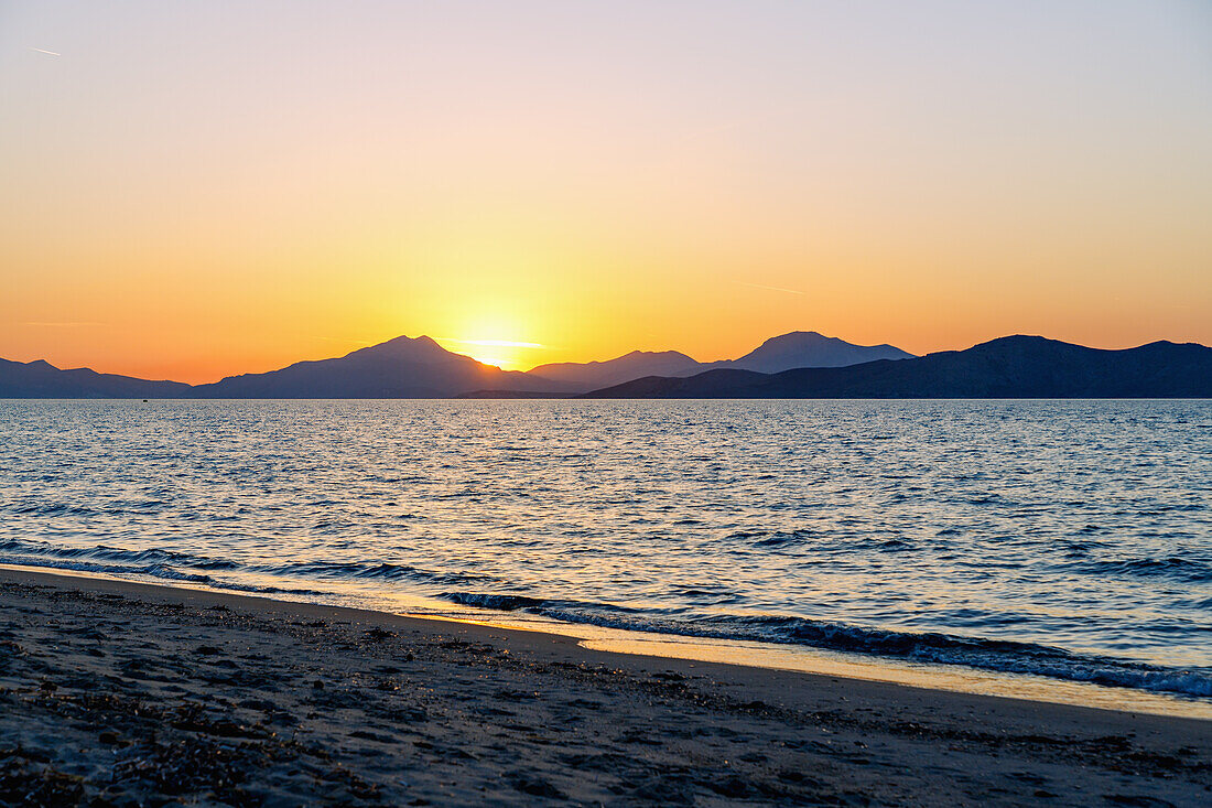  Sunset behind the Turkish coast at Tigaki (Tingaki) beach on the island of Kos in Greece 