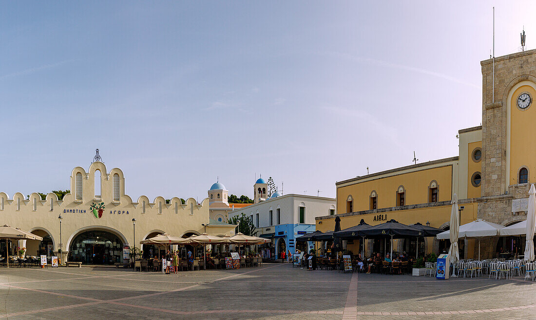  Platia Elefetherias (Freedom Square, Market Square) with market hall, Café Aigli (Aegli) and clock tower in Kos Town on the island of Kos in Greece 