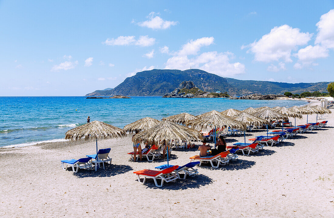  Agios Stefanos Beach overlooking the island of Kastri with the chapel of Agios Nikolaos and the bay of Kefalos on the island of Kos in Greece  