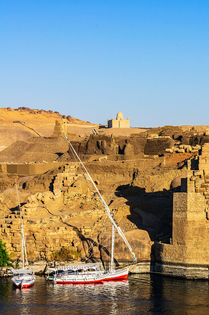  View of the Nile, here the Nile section near Aswan, Egypt, with typical boats and landscape 