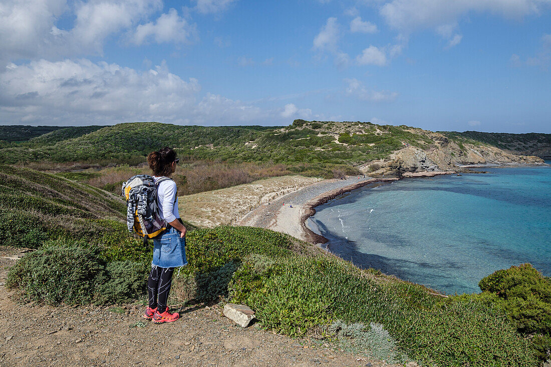 hiker on Tortuga beach, s'Albufera des Grau Natural Park, Menorca, Balearic Islands, Spain