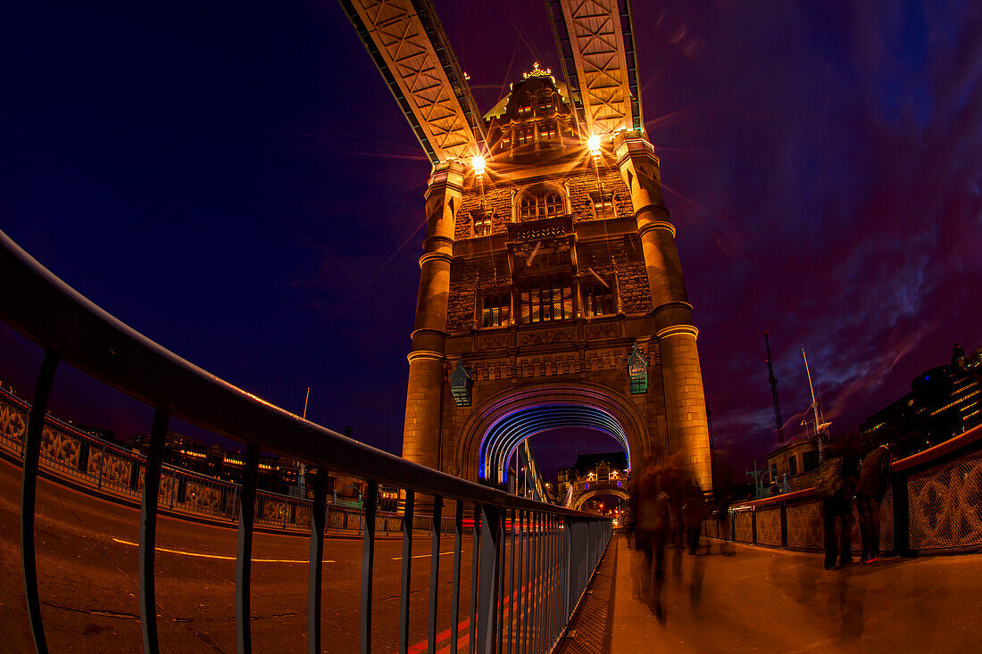  On the Tower Bridge in London at night, UK, Great Britain 