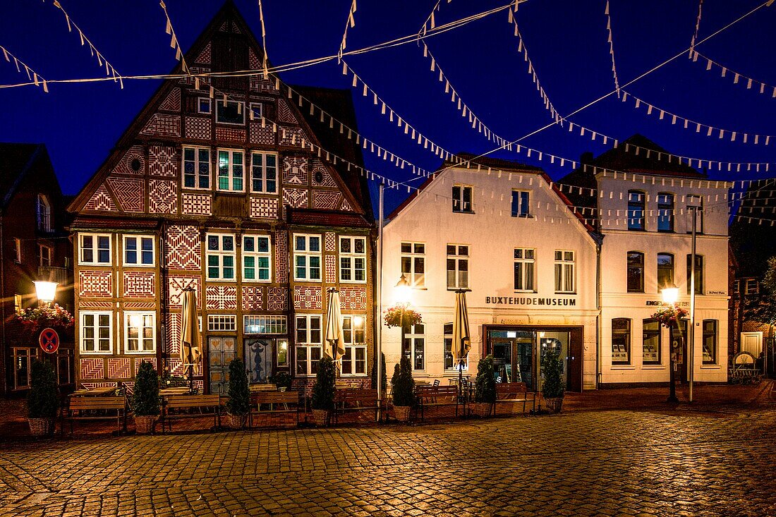  Town houses and Museum Buxtehude at St. Petri Square at night, Buxtehude, Lower Saxony, Germany 