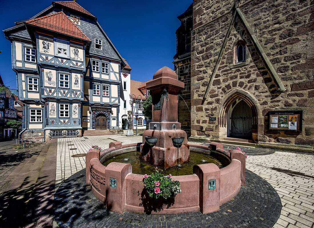  Chancellor Feige fountain, portal of the parish church, Holleum in the old town hall, market square of Hessisch Lichtenau, Hesse, Germany 