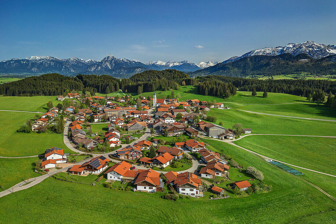  Aerial view of the town of Zell with the Ammergau Alps in the background, Lake Constance-Königssee cycle path, Zell, Allgäu, Swabia, Bavaria, Germany 