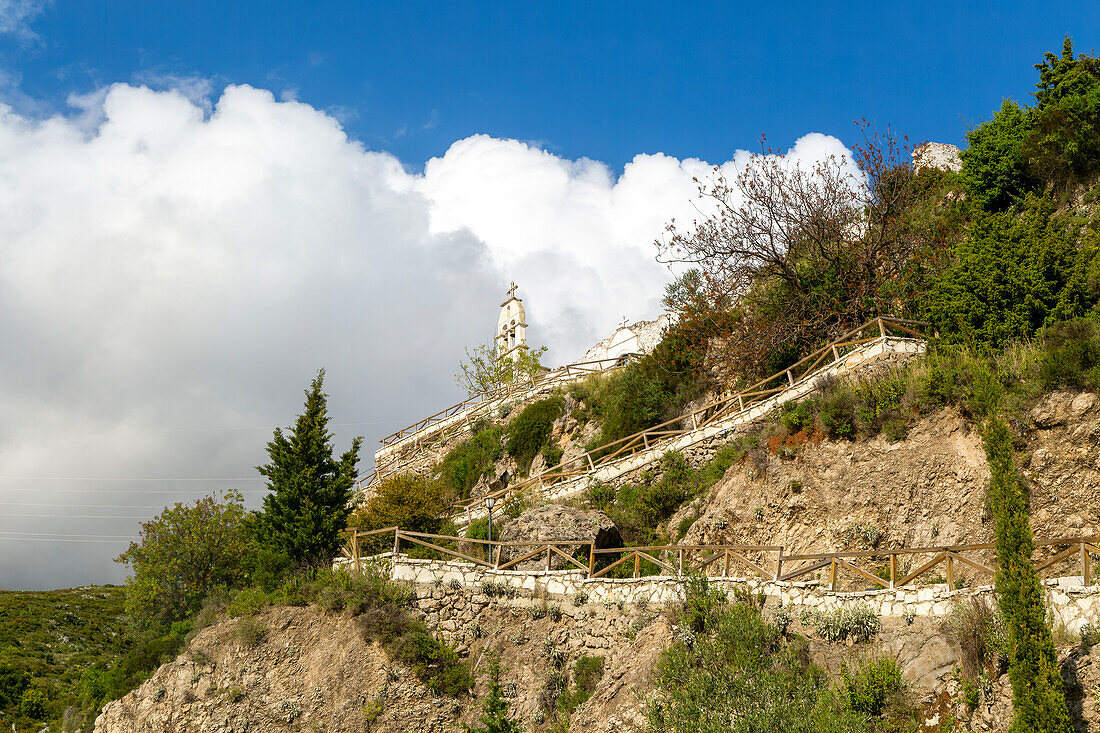 Exterior of Greek Orthodox church of Saint Mary, or Panagia Monastery, Dhermi, Albania steps leading up hillside