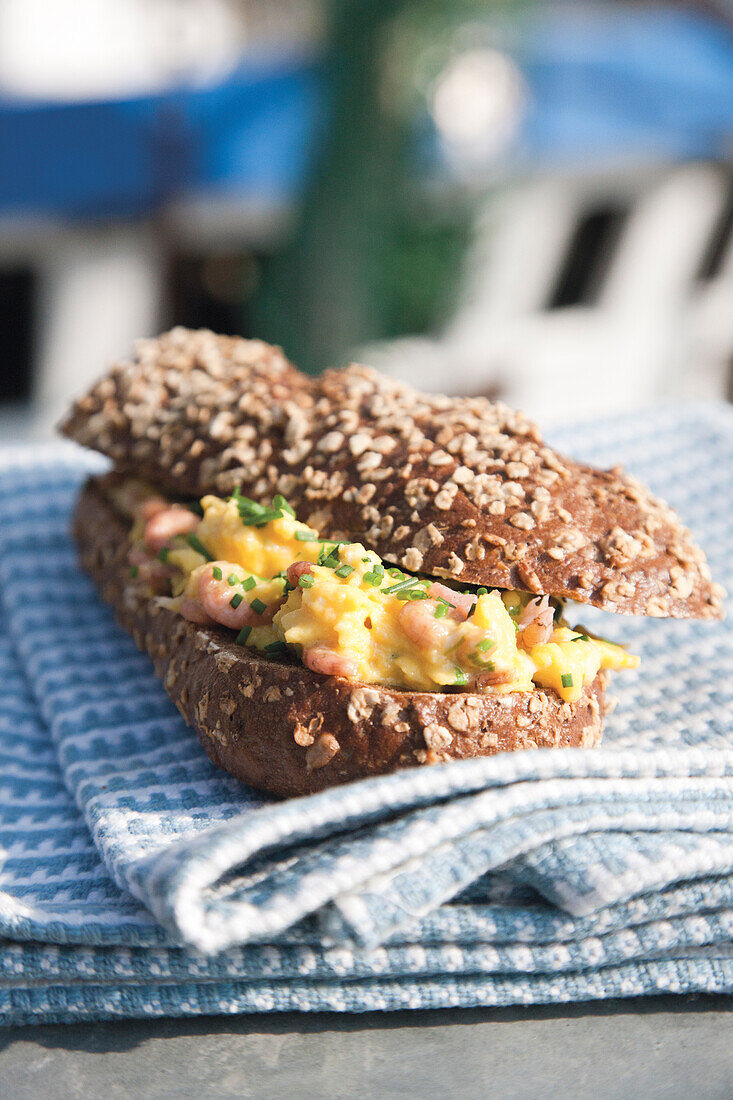  Wholemeal baguette with scrambled eggs and North Sea shrimps 