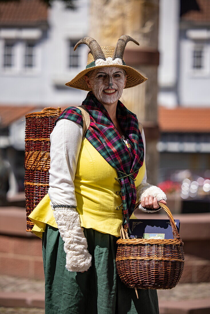  Woman in the costume of the character “Mother Goat” from the fairy tale “The Wolf and the Seven Young Goats” by the Brothers Grimm, Steinau an der Straße, Spessart-Mainland, Hesse, Germany 