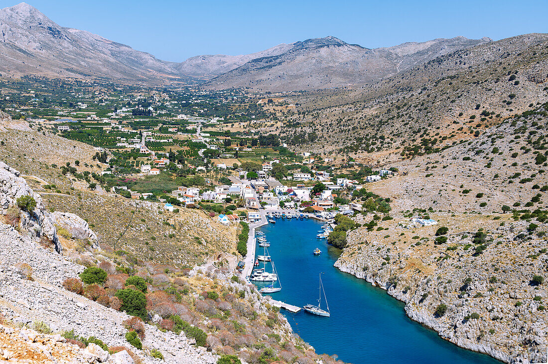  Gulf of Vathí with harbor bay and view into the green valley of Vathí with citrus plantations on the island of Kalymnos (Kalimnos) in Greece 