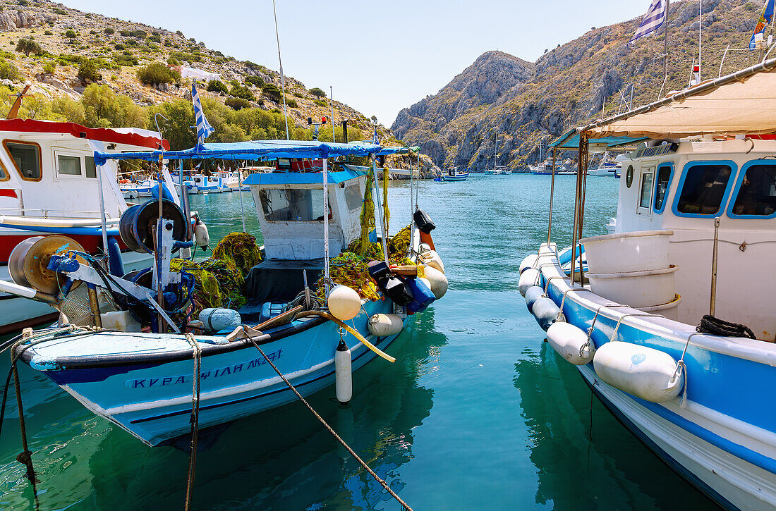  Harbor bay of Vathí with fishing boats and view of the Gulf of Vathí on the island of Kalymnos (Kalimnos) in Greece 