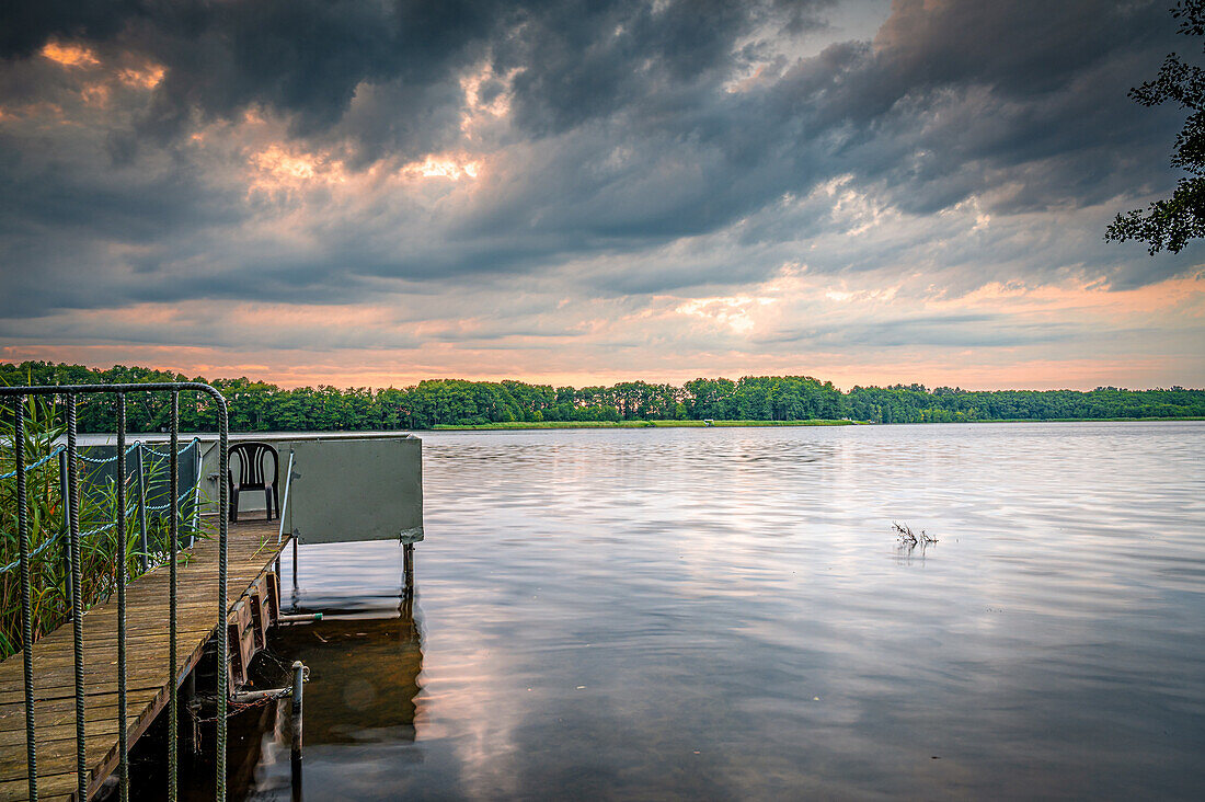  View over the Rahmersee in Zühlsdorf at sunset in summer, Wandlitz, Brandenburg, Germany 