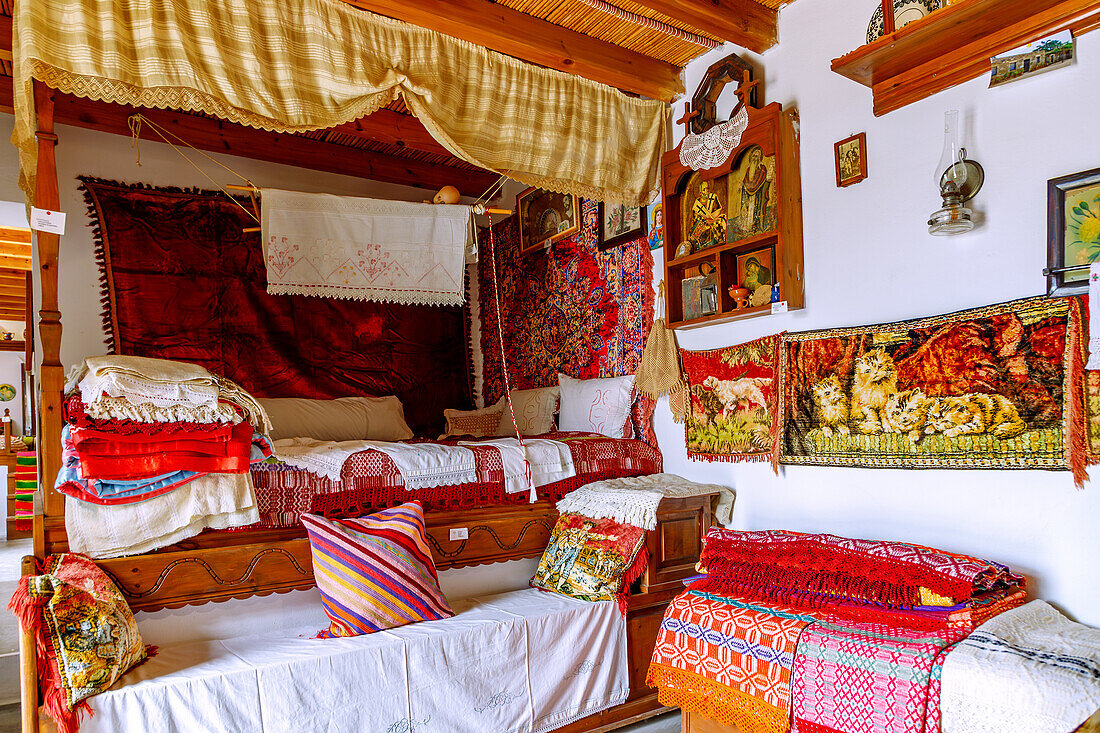  Traditional House of Antimachia on the island of Kos in Greece: Living room with parents&#39; bed and baby cradle hanging above it 