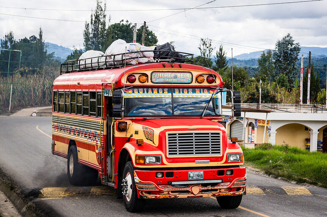 bus jumping a baden, Chichicastenango,  El Quiche, Guatemala, Central America