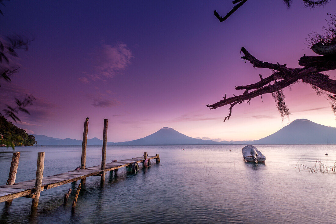 Traditional moorings and volcanoes of Atitlan 3537 m. and San Pedro 3020 m. Lake Atitlan, Sololá Department, Republic of Guatemala, Central America