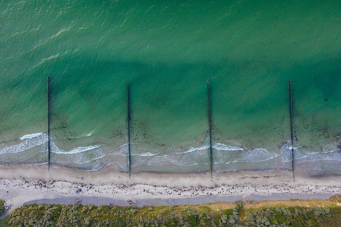  Groynes serve as coastal protection near Wustrow, Fischland, Mecklenburg-Vorpommern, Germany 