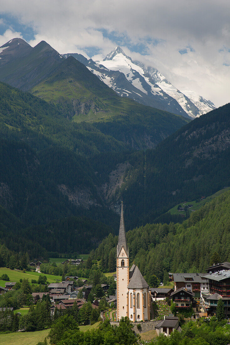  View of the parish church and the town of Heiligenblut with the mountain Gross Glockner, Spittal an der Drau, Carinthia, Austria 