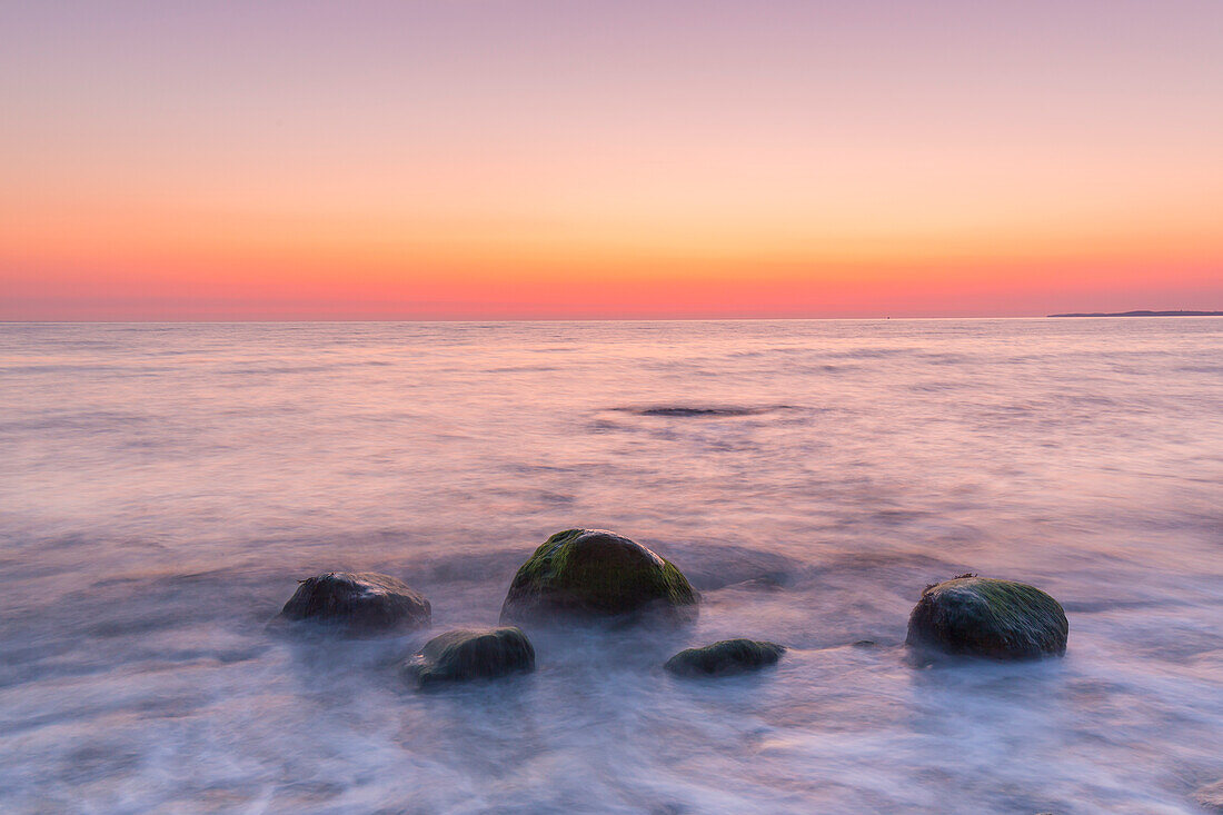  Stones at sunrise on the Brodtener Steilufer on the Baltic Sea, Schleswig-Holstein, Germany 