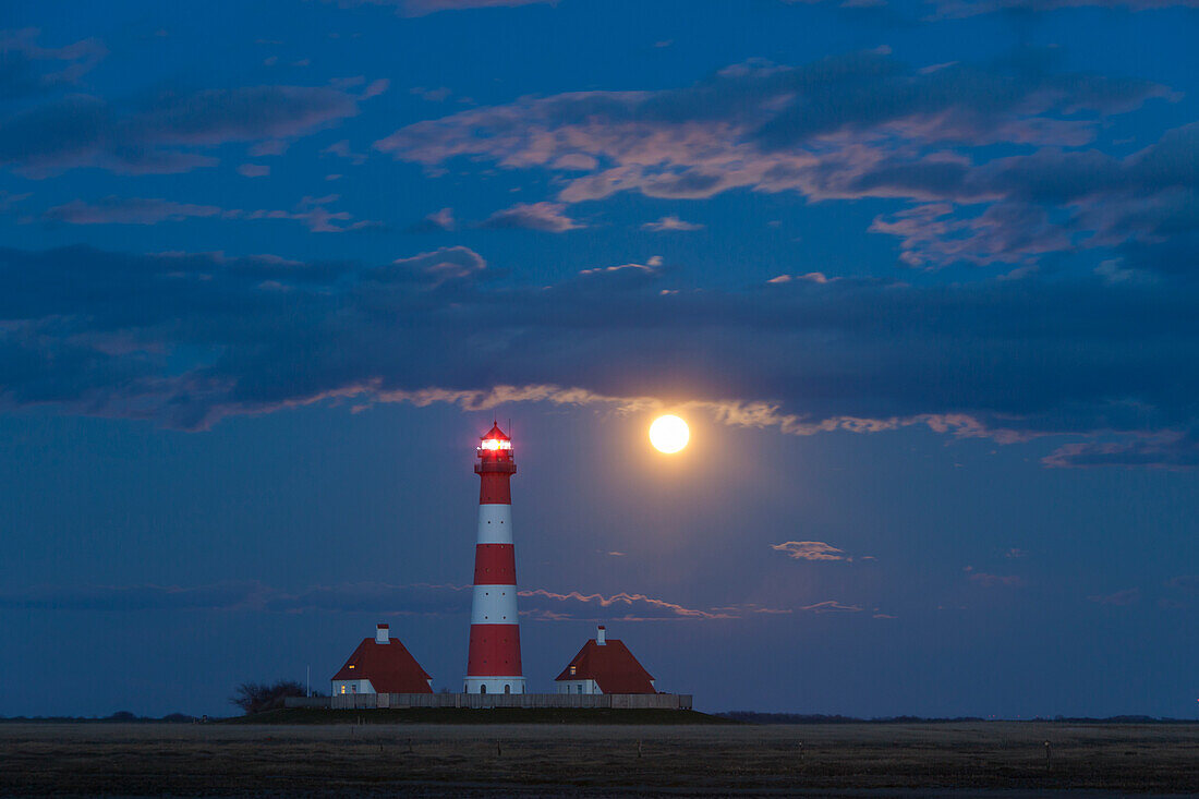  Westerhever lighthouse with full moon, Wadden Sea National Park, North Friesland, Schleswig-Holstein, Germany 