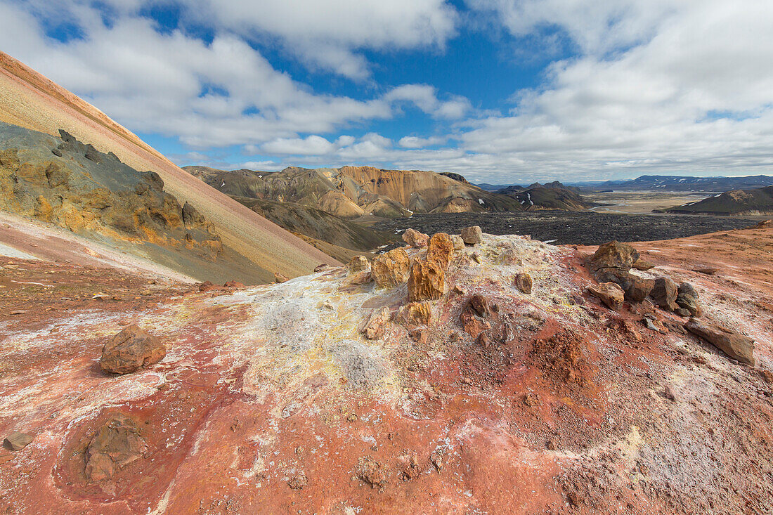  Colourful rhyolite mountains with snow remnants at Brennisteinsalda volcano in Landmannalaugar, Fjallabak National Park, Sudurland, Iceland 