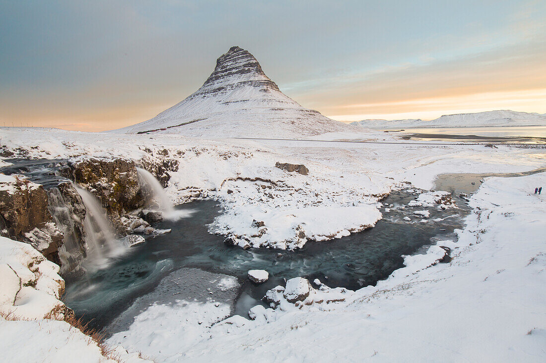  Kirkjufjell mountain with Kirkjufjellsfoss waterfall, winter, Iceland 