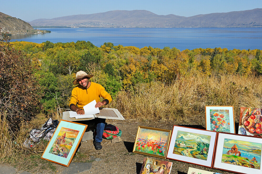 painter exhibiting his work for tourists on the way  to Sevanavank Monastery on Sevan Peninsula, Lake Sevan, Gegharkunik region, Armenia, Eurasia