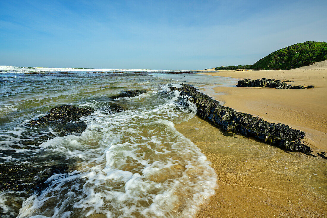  Sea washing up on sandy beach with rock bands, Cannon Rocks Trail, Addo Elephant National Park, Eastern Cape, South Africa 