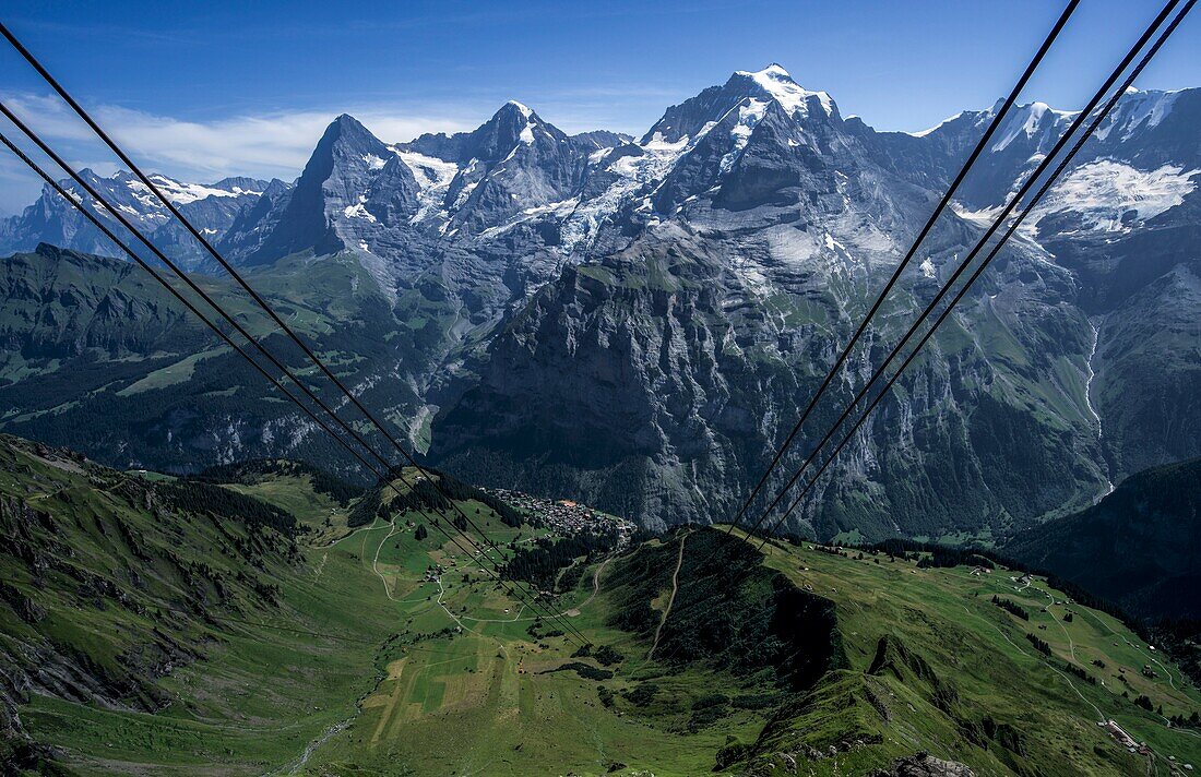  View from the cable car station Birg over alpine meadows, the alpine village of Mürren, Eiger, Mönch and Jungfrau, Bernese Oberland, Switzerland 